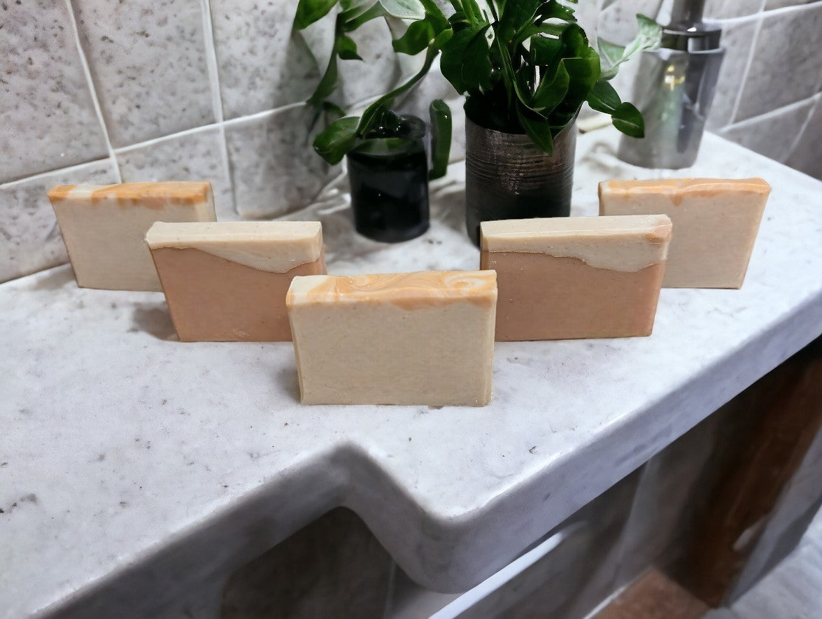 Travel or guest size soap, cold process soap featuring tangerine and tan block coloring separated by a gold mica line.  The scent is a refreshing blend of tangy citrus fruits (lemon, lime, grapefruit) paired with subtle notes of cucumber, pineapple, blackberry, and champagne. Think Burst of Energy* and you'll understand the scent. Also available in regular size, and small sizes.