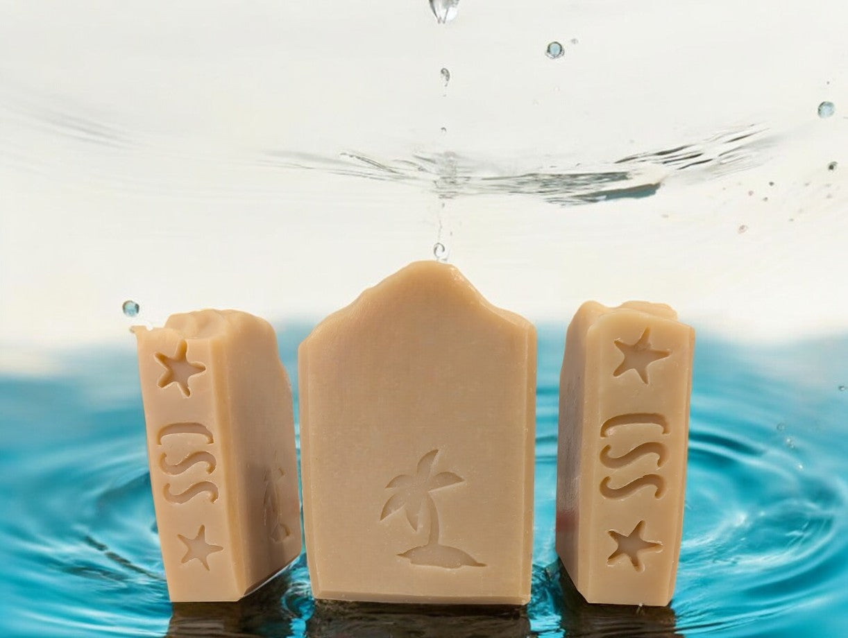 Handcrafted creamy tan soap with a palm tree stamped on the front of this harmonious, soap boasting the earthy fragrance of Sandwood Patchouli with Hemp Oil and Dead Sea Mud.  It's a perfect addition to your bath and body products!