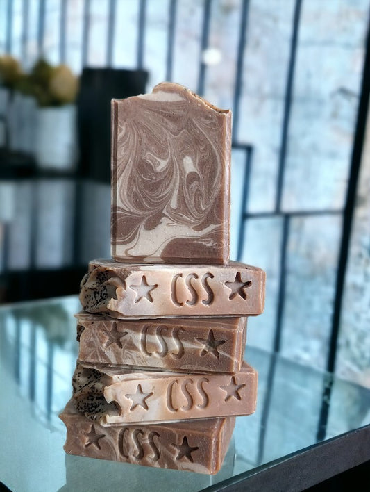 Cold process bar.  Darker Brown coffee soap with creamy colored swirls.  This Project Soapway Competition winner is loaded up with skin loving ingredients like Kaolin Clay and Colloidal oats, this sudsy delight is handcrafted with organic fresh brewed coffee and Espresso coffee fragrance oil.  This soap delivers a crazy big and delightful lather.