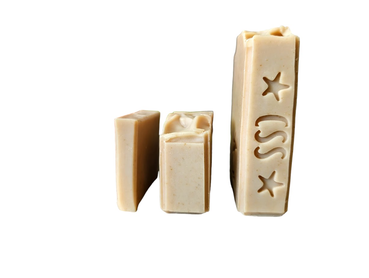 Smokey Beige colored, nourishing, skin care soap with Palm Tree, paw print, dolphin clown fish or sea horse embellishments. Features goat milk, kaolin clay, colloidal oats, & other skin loving ingredients, this skin loving soap is topped off with the divine Palo Santo fragrance oil. Comes in 3 sizes: Regular bar, Small Bar and Travel / Guest size bar