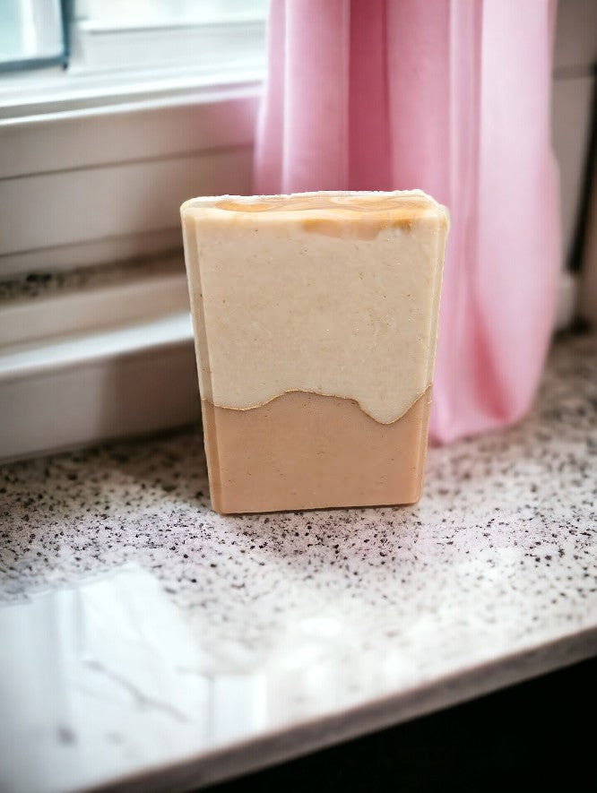 Handcrafted, cold process soap featuring tangerine and tan block coloring separated by a gold mica line.  The scent is a refreshing blend of tangy citrus fruits (lemon, lime, grapefruit) paired with subtle notes of cucumber, pineapple, blackberry, and champagne. Think Burst of Energy* and you'll understand the scent.  You'll up your personal care game with this one!