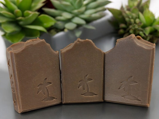 Dark green soap with a palm tree stamped on the front of this harmonious, soap boasting the earthy fragrance of Patchouli with Hemp Oil and Kaolin Clay.  It features a refined, understated Patchouli aroma, far from the overwhelming scent that may evoke memories of one's youth.