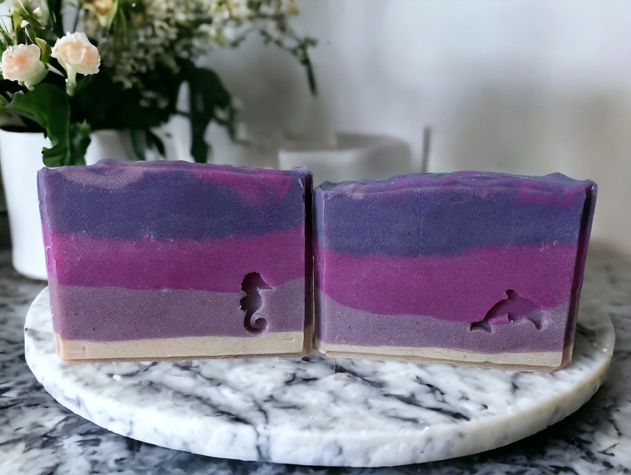 This Handmade Cedar musk and Lavender soap features 7 layers of purple. 3 Sizes: Regular bar, Small bar and Travel / Guest size bar. Think BBW White Barn® Mahogany Teakwood and you'll understand the scent. A great smelling addition to your personal care products!