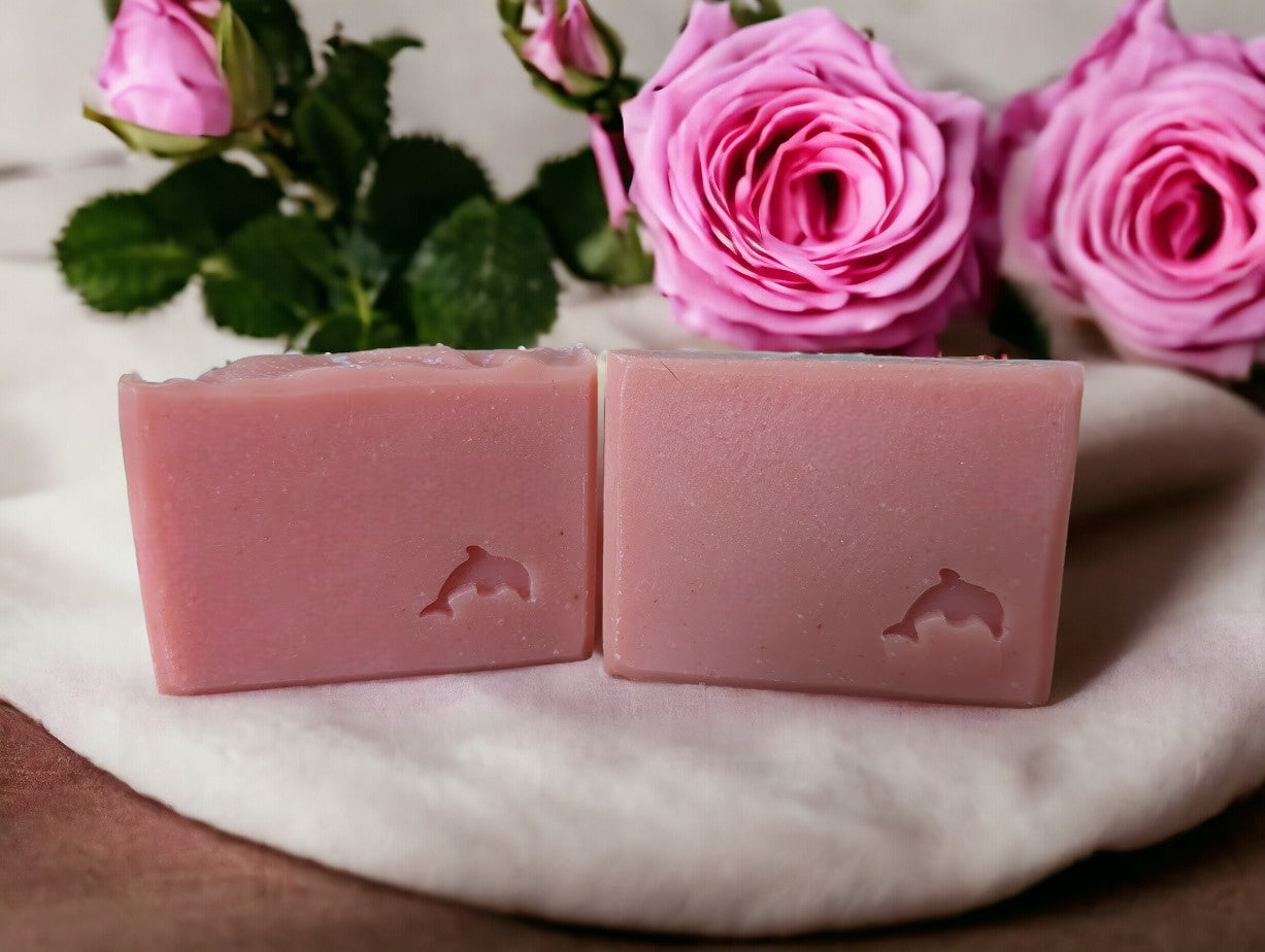 Pink in color adorned with 'dew' on top (biodegradable glitter). Rose Goat, Kaolin Clay and Oatmeal Milk Soap with realistic fresh cut roses scent - 3 sizes including Regular, Small and Travel, Guest or Hotel size soap bars - Good soap