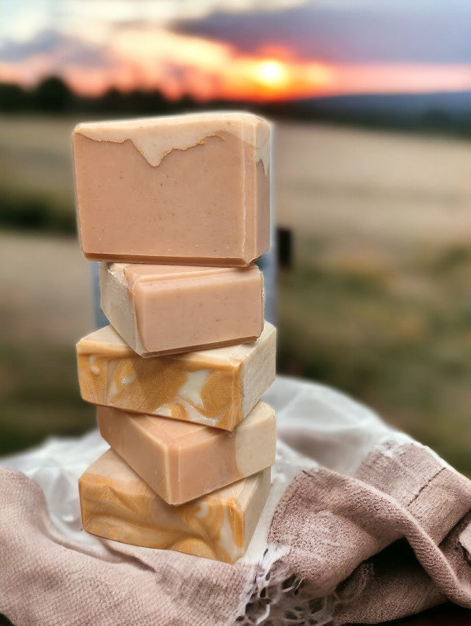 Small size, cold process soap featuring tangerine and tan block coloring separated by a gold mica line.  The scent is a refreshing blend of tangy citrus fruits (lemon, lime, grapefruit) paired with subtle notes of cucumber, pineapple, blackberry, and champagne. Think Burst of Energy* and you'll understand the scent. Also available in regular size, and travel / guest size.