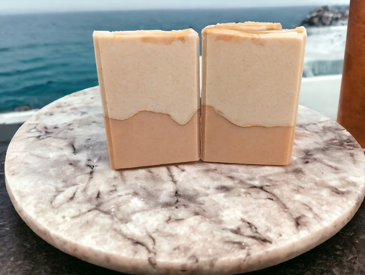 Handcrafted, cold process soap featuring tangerine and tan block coloring separated by a gold mica line.  The scent is a refreshing blend of tangy citrus fruits (lemon, lime, grapefruit) paired with subtle notes of cucumber, pineapple, blackberry, and champagne. Think Burst of Energy* and you'll understand the scent.  Great for your skin soap!