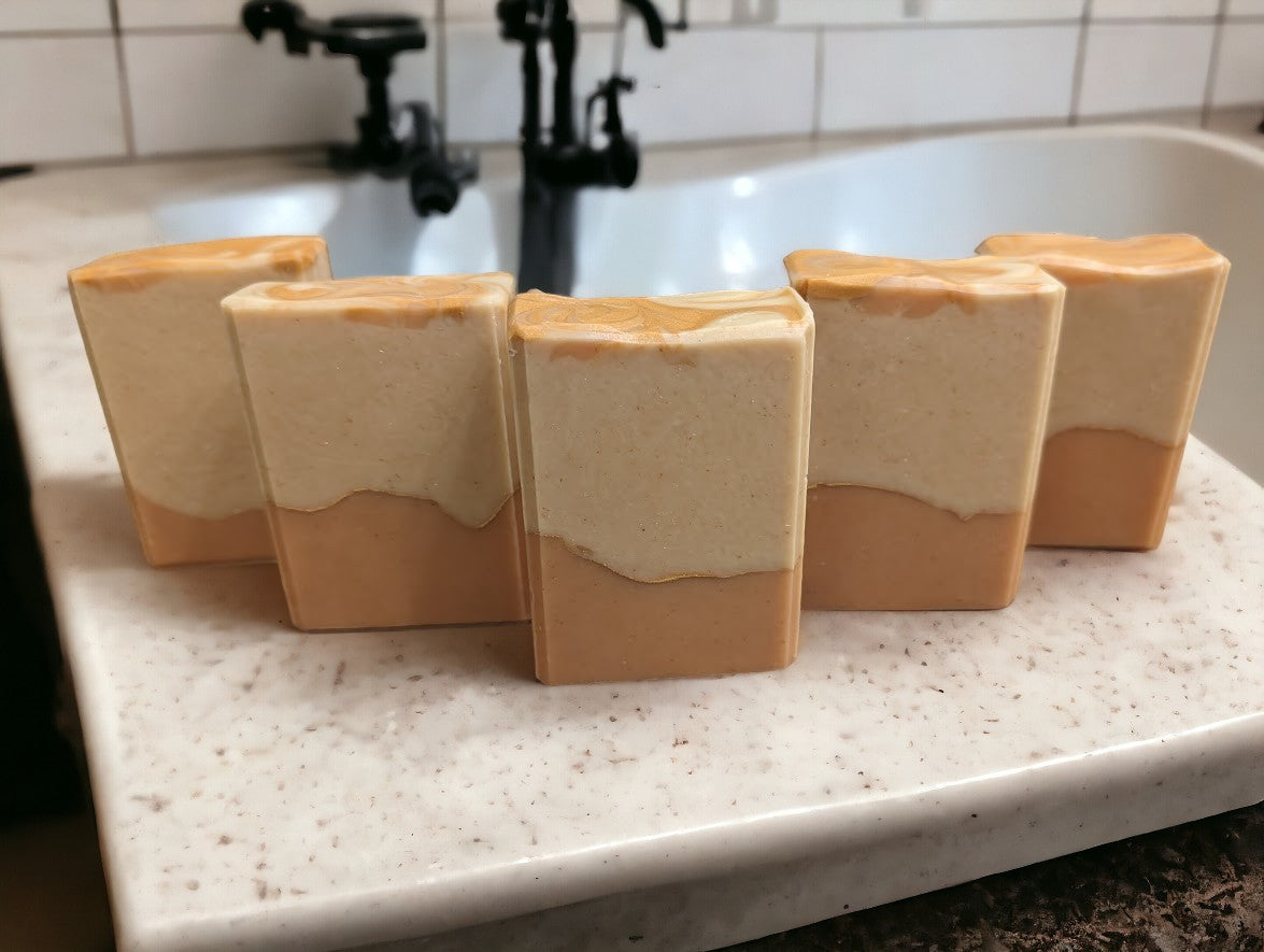 Handcrafted, cold process soap featuring tangerine and tan block coloring separated by a gold mica line.  The scent is a refreshing blend of tangy citrus fruits (lemon, lime, grapefruit) paired with subtle notes of cucumber, pineapple, blackberry, and champagne. Think Burst of Energy* and you'll understand the scent.  Great for your skin skin care!