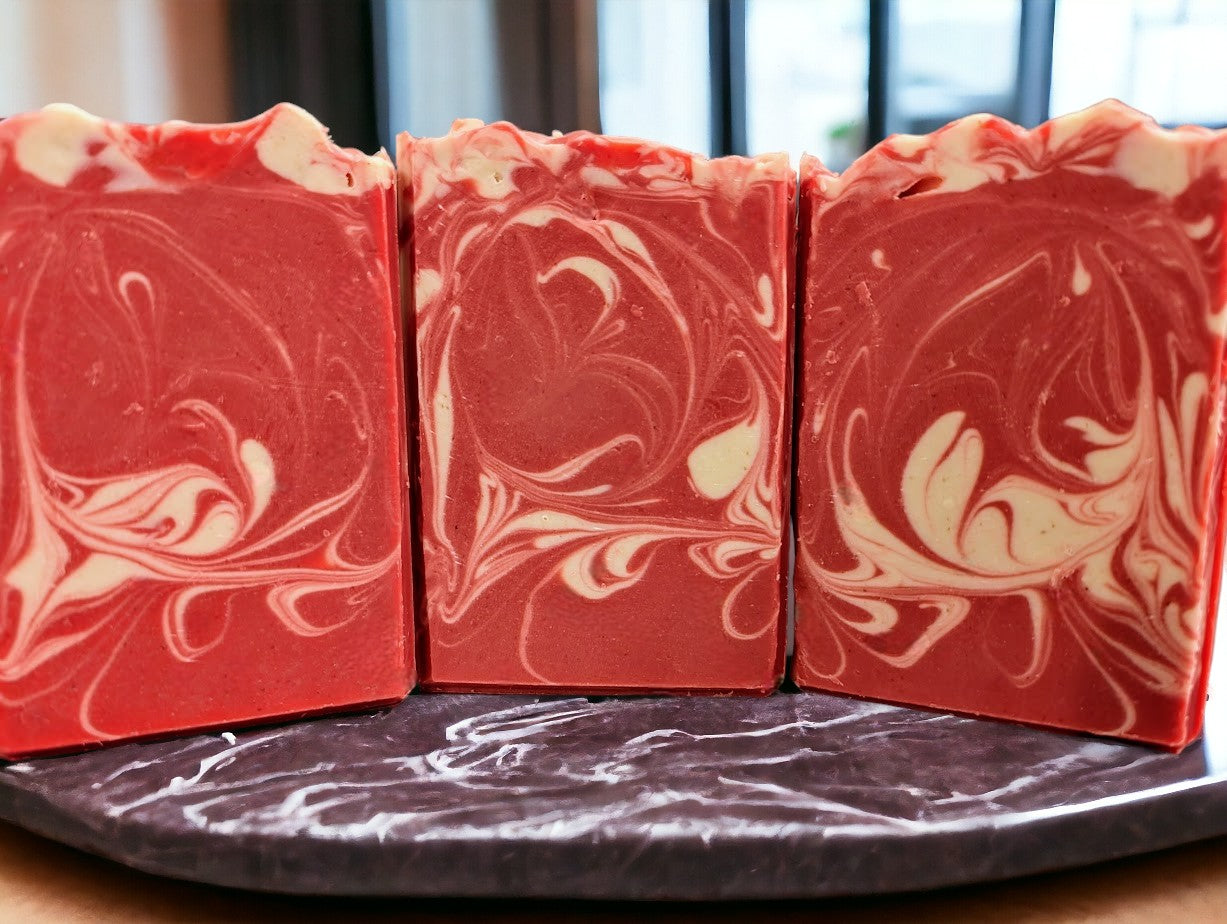 Handmade and cut cold processed soap. Strawberry Red colored soap with white swirls. Fresh Picked Strawberry fragrance oil. 3 sizes: Regular, Small and Travel Size for your bath care needs.
