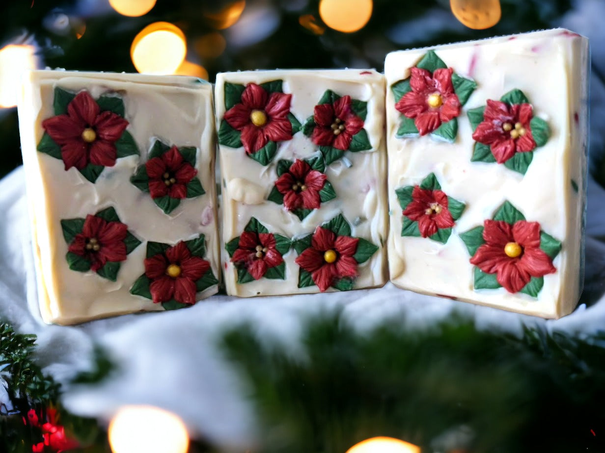 Take your holiday decor to the next level of festive with the Poinsettia Pizzazz Christmas soap! The soap is layered with Christmas green and off white with green, red and white soap sprinkles. The top of the soap is adorned with beautiful soap poinsettias. This decorative holiday soap is sure to make a splash in the bathroom! So, make a statement this Christmas and get your poinsettia on!