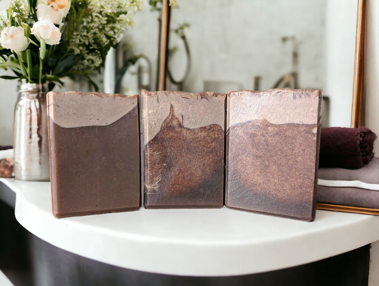 Cafe Mocha Coffee soap fragranced with Hot Chocolate. Top is a creamy light tan color with brown base that looks like aged leather on some bars. Goat milk, Colloidal oats and coffee are some of the skin loving ingredients in this bubbly bar soap.