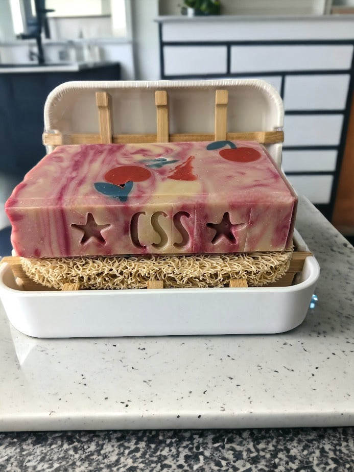 100% natural -- crafted from bamboo, bamboo fiber, and corn starch! White base with bamboo inset. It looks great in the kitchen or the bathroom, and it's easy to clean. Most importantly it'll help keep your soap dry and high, which helps make sure your small-batch, handcrafted soap will last. Get your environment-friendly soap saver today and save your soap for tomorrow! A small but impactful way to reduce our eco-footprint!