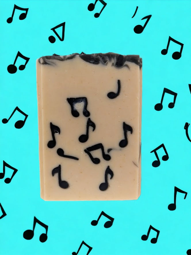 Fun artisan, skin lovin’ Tallow Bar Soap, cream background with black Musical Notes embedded throughout. Handcrafted in small batches with goat's milk and a light Bamboo and Teakwood scent along with other skin lovin' ingredients, it's sure to be a hit with music lovers!