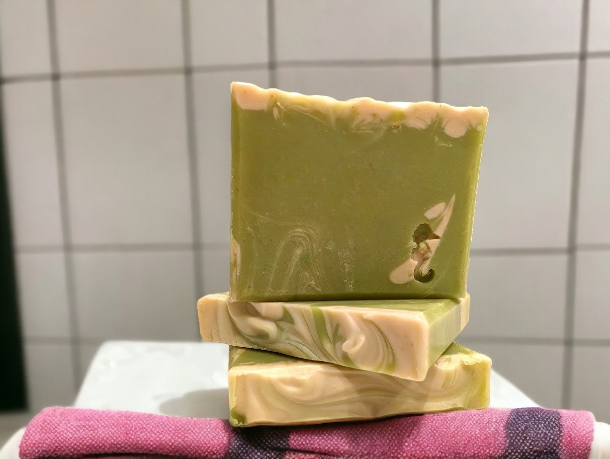 Lime green small travel or guest sized bar soap with cream swirl accents. Scented with Key Lime Pie fragrance oil. Each stamp is stamped with dolphins, sea horses or clown fish. Soap features Hemp Oil, Shea Butter, Goat Milk, Kaolin clay and colloidal oats.