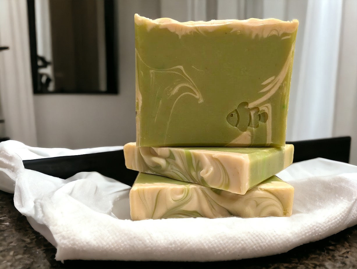 Lime green small travel or guest sized bar soap with cream swirl accents. Scented with Key Lime Pie fragrance oil. Each stamp is stamped with dolphins, sea horses or clown fish. Soap features Hemp Oil, Shea Butter, Goat Milk, Kaolin clay and colloidal oats.