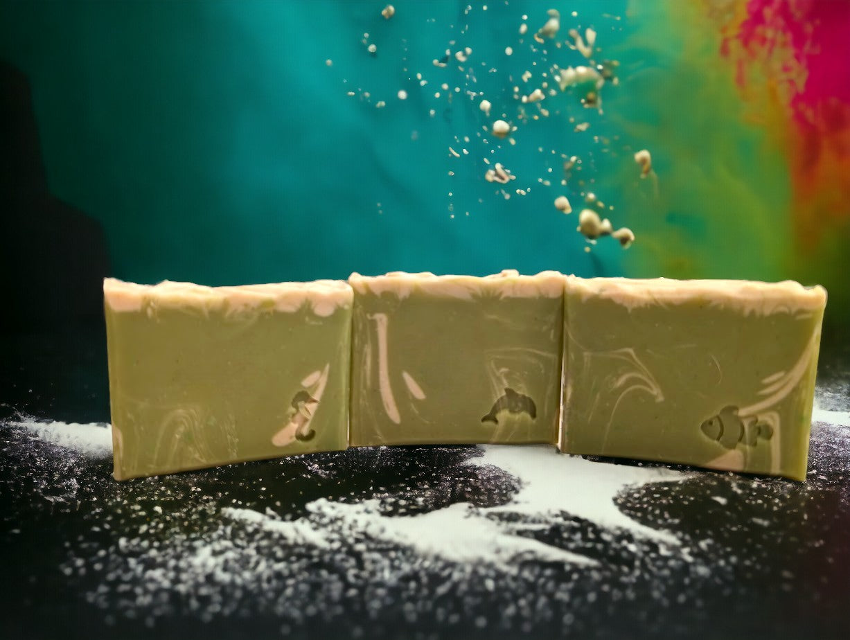 Lime green small travel or guest sized bar soap with cream swirl accents. Scented with Key Lime Pie fragrance oil. Each stamp is stamped with dolphins, sea horses or clown fish. Soap features Hemp Oil, Shea Butter, Goat Milk, Kaolin clay and colloidal oats.
