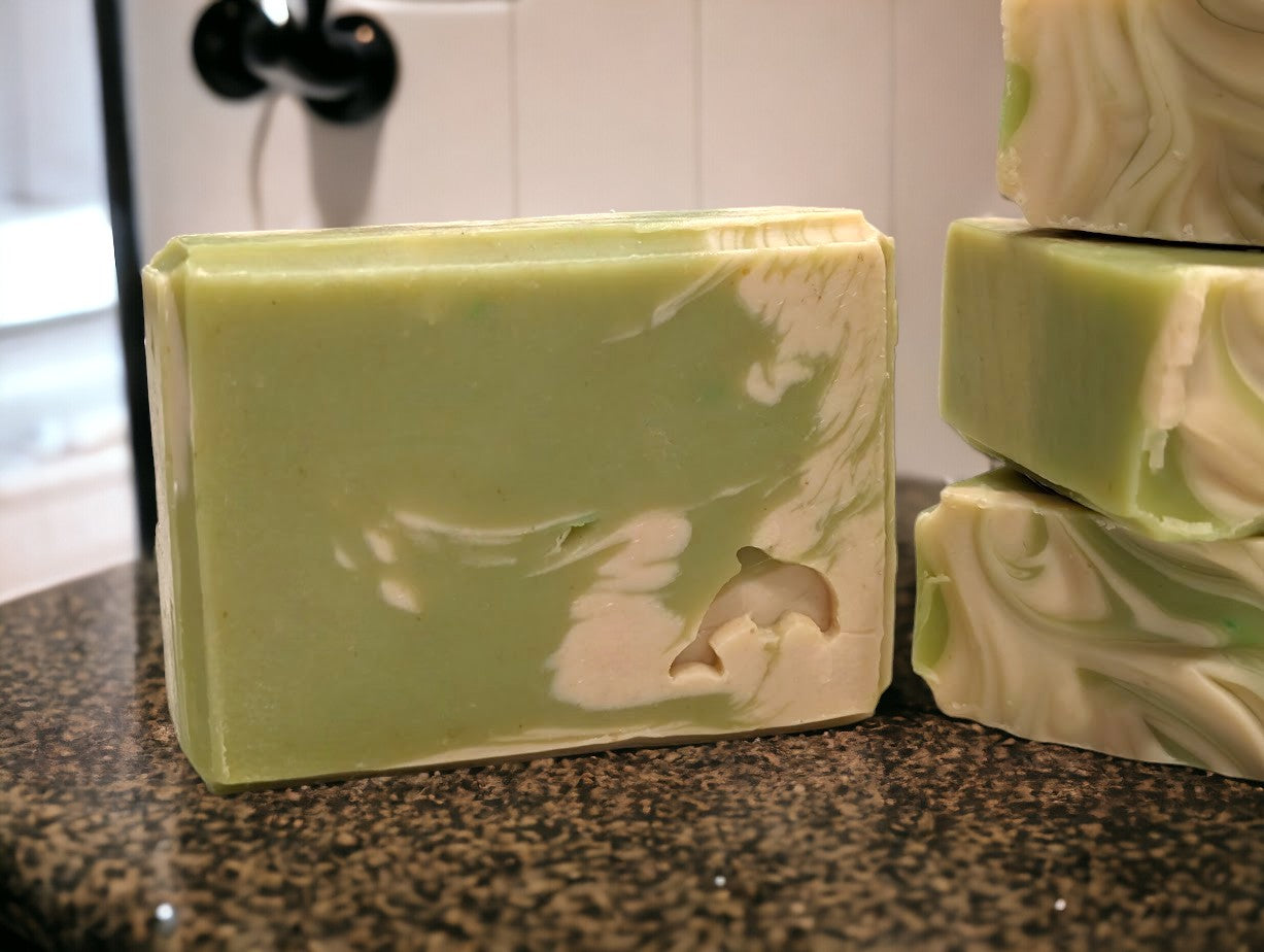 Lime green small travel or guest sized bar soap with cream swirl accents. Scented with Key Lime Pie fragrance oil. Each stamp is stamped with dolphins, sea horses or clown fish. Soap features Hemp Oil, Shea Butter, Goat Milk, Kaolin clay and colloidal oats.
