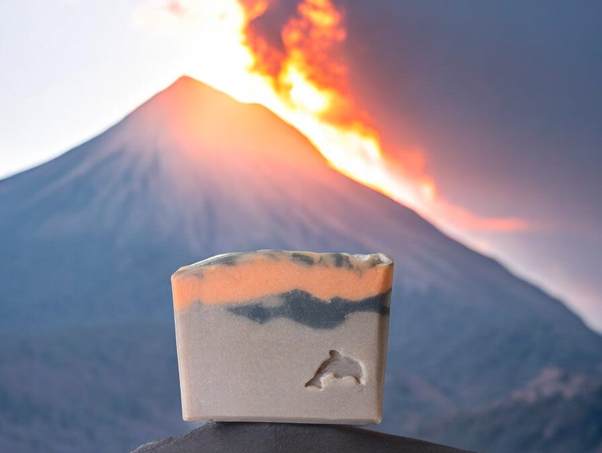 Artisan brown volcano goat milk soap adorned with orange and black soap (lava).This is a good for your skin, big bubble bar with a light luxurious lather. Similar to Capri Blue®'s Volcano. Available in regular bar size, small (or half size) and Hotel, Travel, Guest size.