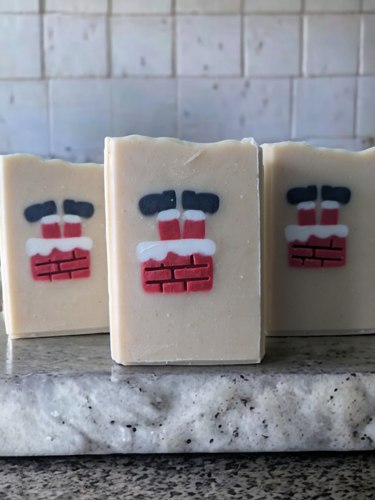 Get in the Christmas spirit with Delayed Delivery! – the perfect piece for your holiday decor. Scented with Peppermint Stick fragrance oil, this delightful tallow soap features an embed of Santa Santa stuck in a chimney with his feet in the air.  The embed is throughout the entire width of the soap.  This handcrafted, decorative soap will make your daily washing a tad more cheerful and merry.