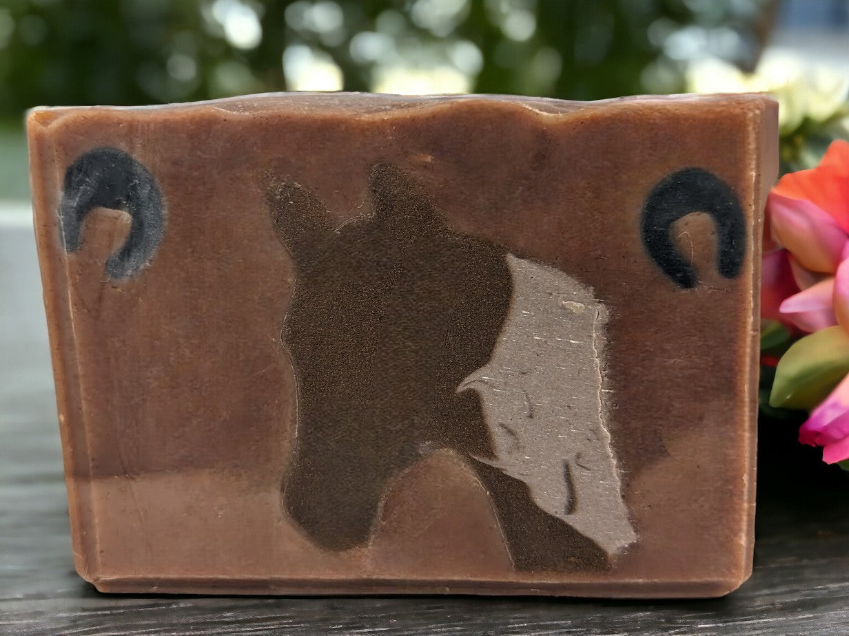 Soap featuring Horse head silhouette against a two tone brown background. This unique soap is the perfect artisanal gift for any equine or animal lover. Lovingly crafted with top-notch ingredients like goat milk and colloidal oats.