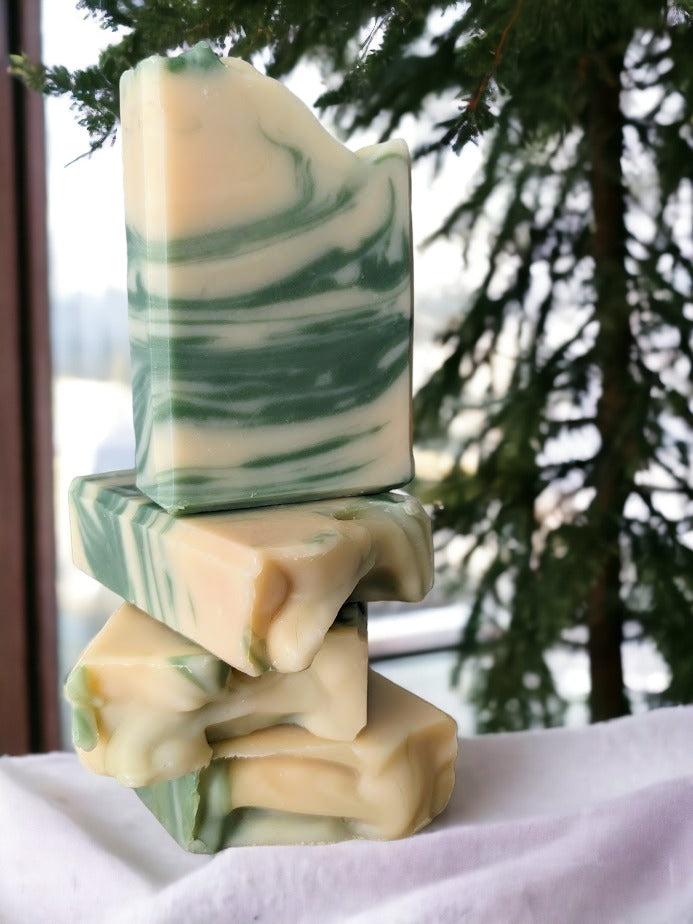 Our Luxurious everyday Tobacco and Bay Leaf soap is bursting with nourishing and skin-pampering goodies like mango, shea and cocoa butters! The Tobacco and Bay Leaf scent is a tantalizing mix of bay leaf, fir needle, cedarwood, bergamot, and tobacco. This simple, swirly design of cream and green will add zing to your shower - because who wants boring soap?