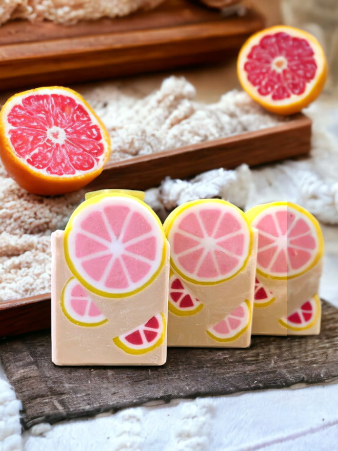 Start your day with our refreshing Zestpresso Delight handcrafted grapefruit scent and coffee soap bar! This bar has a grapefruit slice peeking out of the top of the bar and 2 smaller half grapefruit slices in the body of the bar.  Made with coffee and 4 of Mother Nature's most nourishing butters, it's a treat for your skin. Pamper yourself or that special someone with our luxurious soap bar and ake up your senses with this zesty delight!