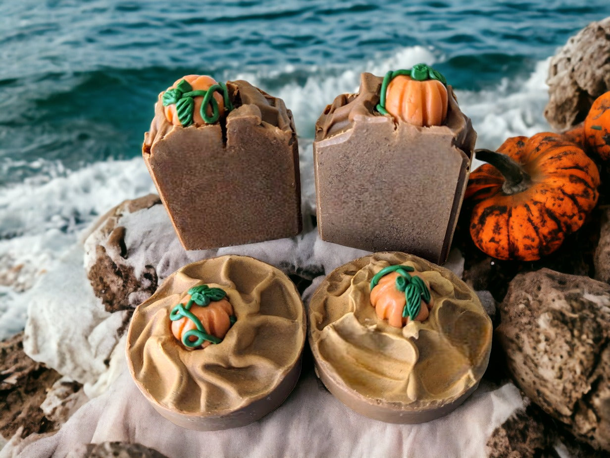3 variants of Pumpkin Spice bar soap: Tall with pumpkin on top, round with pumpkin on top and round with no pumpkin on top. Brown in color.