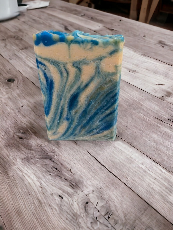 This artisan soap bar smells heavenly, and wows with its whimsical swirls of blue, creamy white and veins of gold. Every single bar of soap different in appearance. Reminiscent of an August sunset here in Florida, this beautiful soap has a fantastic sudsy lather -- lots of bubbles!  The scent on this soap is divine!!  Think Amazing Grace* by Philosopy and you'll get it.  Notes of Bergamot, lemon, citron and neroli, jasmine, orange blossom and rose with touch of musk and cedarwood.