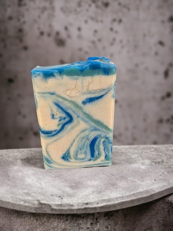 This artisan soap bar smells heavenly, and wows with its whimsical swirls of blue, creamy white and veins of gold. Every single bar of soap different in appearance. Reminiscent of an August sunset here in Florida, this beautiful soap has a fantastic sudsy lather -- bubbles galore!  The scent on this soap is divine!!  Think Amazing Grace* by Philosopy and you'll get it.  Notes of Bergamot, lemon, citron and neroli, jasmine, orange blossom and rose with touch of musk and cedarwood.  Divine-ness personified!