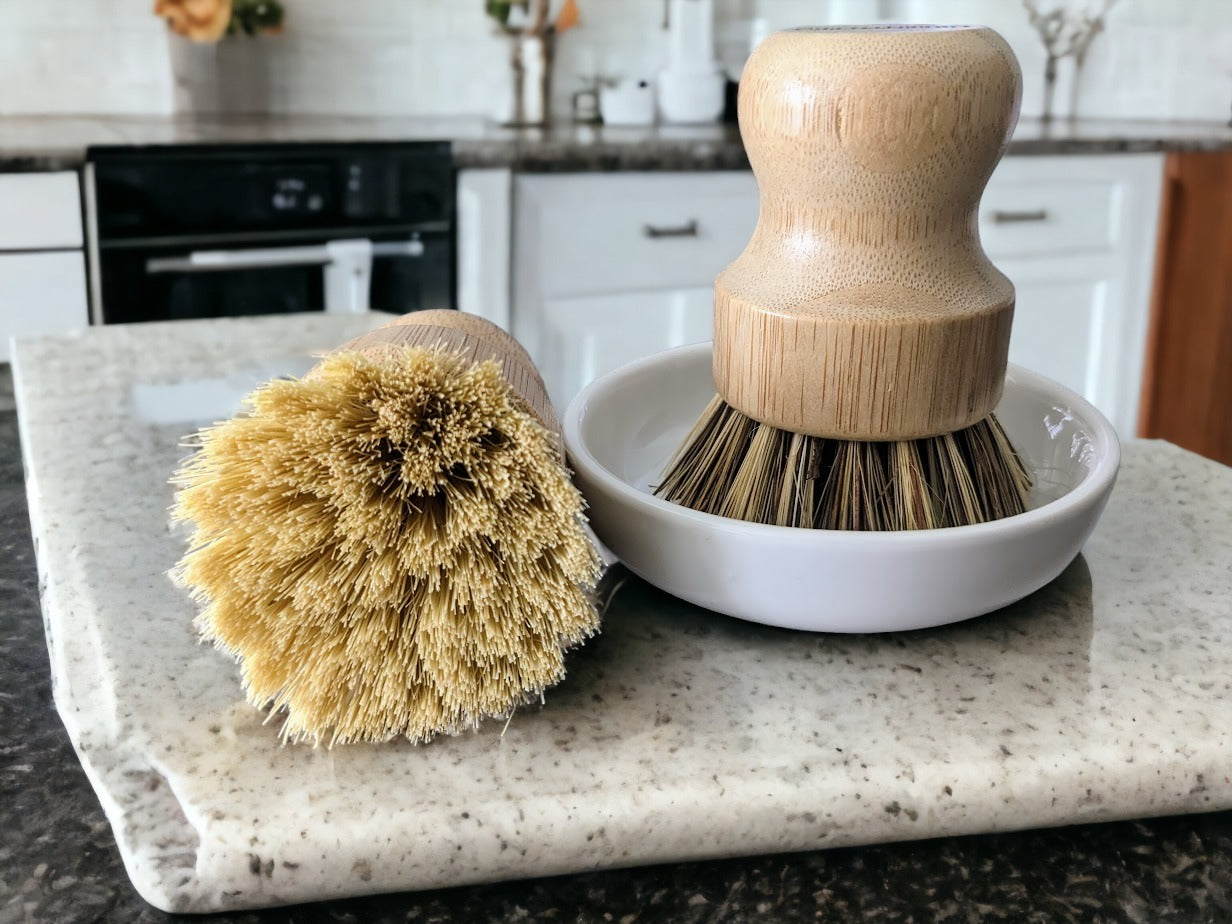 Eco-friendly bamboo dish scrubber with natural sisal bristles.