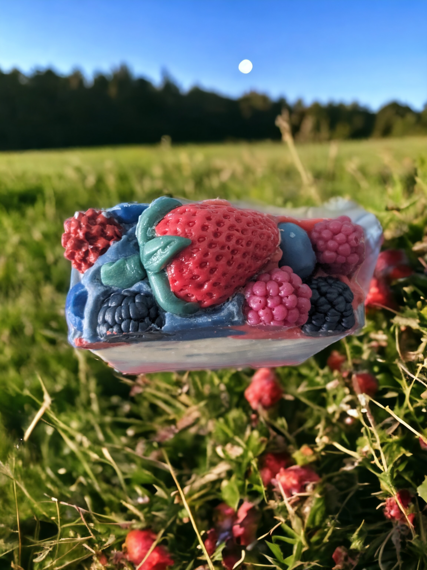 This 4 butter soap bar is a delight with it's Strawberry, Blueberry, Raspberry and Blackberry topped design. Loaded with skin loving ingredients, like shea, cocoa and mango butters, enjoy the luxurious blend of 'Berry Delightful' soap. The scent is a juicy scent mix of bergamot, blackberry, raspberry, peony, honeysuckle, and violet leaf. Notes of white woods, golden amber, and musk add complexity and depth.