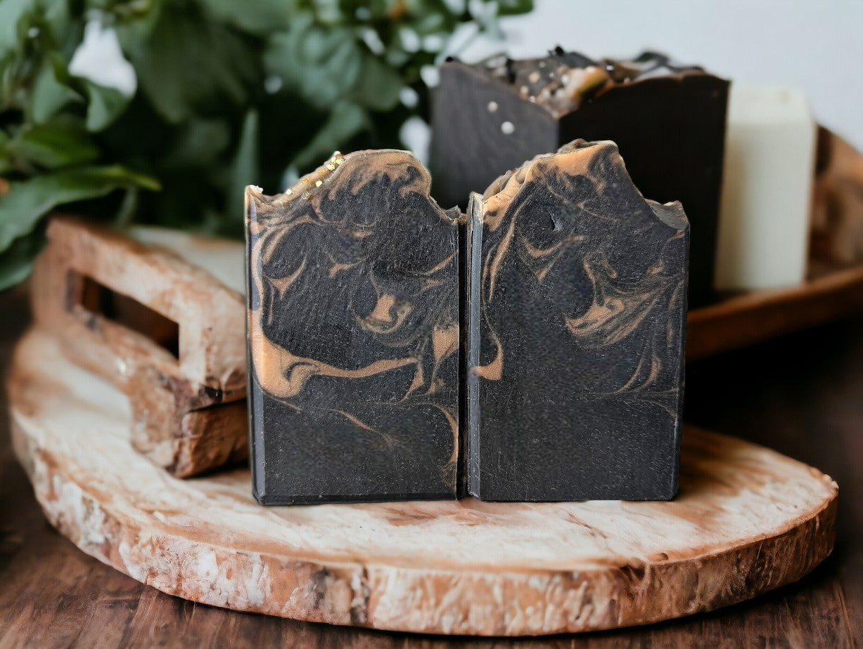 Black soap with gold swirls.  Healthy and skin loving ingredients include Activated Charcoal, Kaolin Clay, Colloidal Oats and Coconut milk.  Fragranced with Lavender and Black Amber Fragranced Bar Soap.