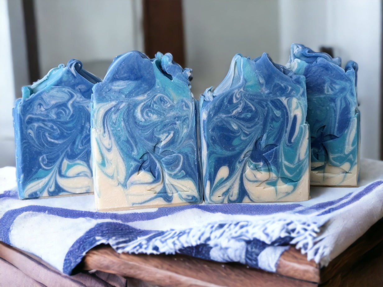 Luxurious Blackberry Vanilla soap bar!  This delightful bar for him or her features whispy swirls in shades of blue and white.  Made with the finest butters and oils Mother Nature has to offer, this bar soap is sure to leave you feeling positively pampered. Give the royal scrub a try today!