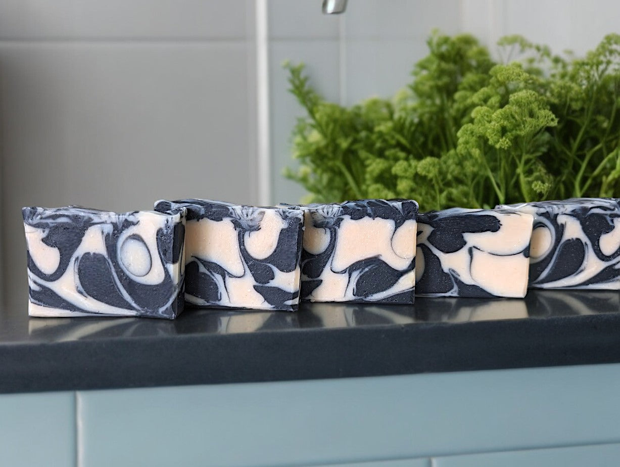 All natural and unscented Goat Milk and Sea Moss bar soap featuring black and white drop-swirls. It's an excellent option for those who are looking for an all-natural and eco-friendly soap with ethically harvested and sustainable ingredients.