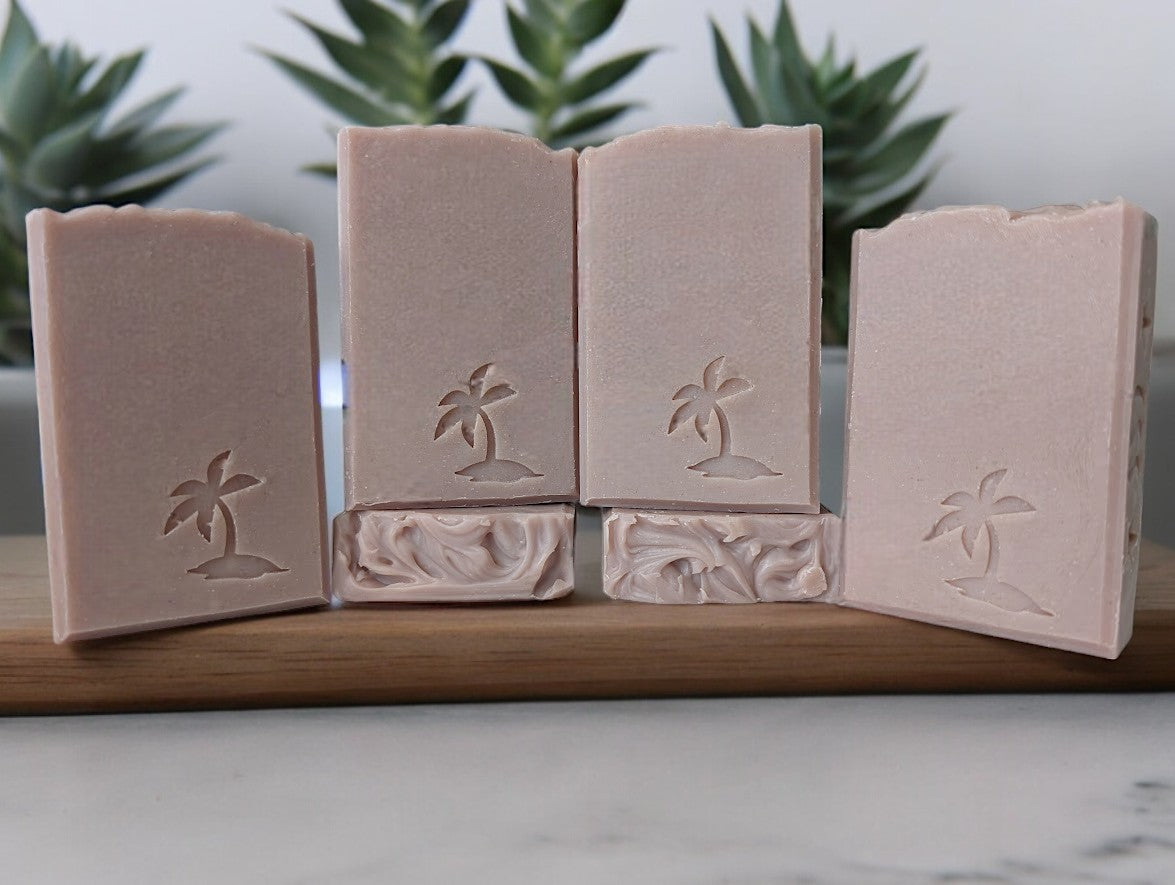 A handcrafted bar soap that is mauve-colored soap with a dreamy blend of lilac aroma, hints of greenery, and skin-enriching ingredients like goat milk, avocado oil, colloidal oats, kaolin clay, and nutrient-dense sea moss.