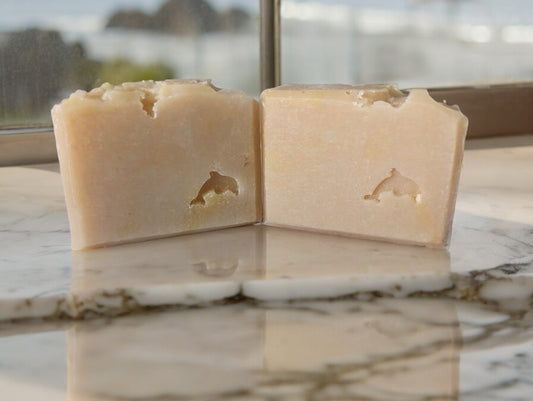 This handcrafted luscious goat milk and sea moss soap is named 'Hawaiian Aloha'and will make an excellent addition to your personal care products. Single color of yellowish beige with a dolphin stamped on the front.  Scented with Plumeria.  Particularly suited to those seeking more natural soap.  Available in Small size and Hotel size bars.