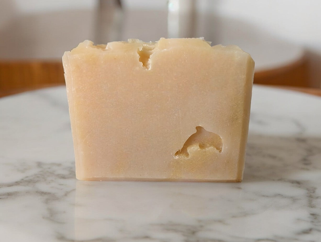 This artisan goat milk and sea moss soap is named 'Hawaiian Aloha'and is suited to those looking for sustainably sourced soap. Single color of yellowish beige with a dolphin stamped on the front.  Scented with Plumeria.  Available in Hotel sized bars that are perfect for travel or guests.