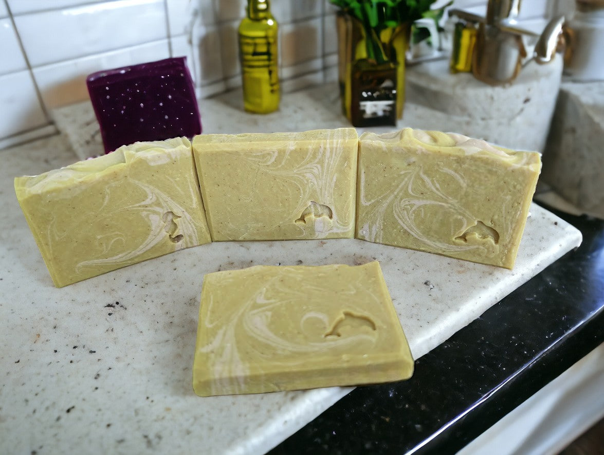 Gentle handcrafted soap bar. Banana Breeze Bar soap (aka Monkey Farts) featuring Goat Milk Soap, Colloidal oats, kaolin clay and banana fragrance to up your personal care game.  Mustard colored base with white swirls. Available in 3 sizes Regular bar, small bar and Travel Guest Hotel sized soap bar. Available from Cheryl's Southern Soapery.