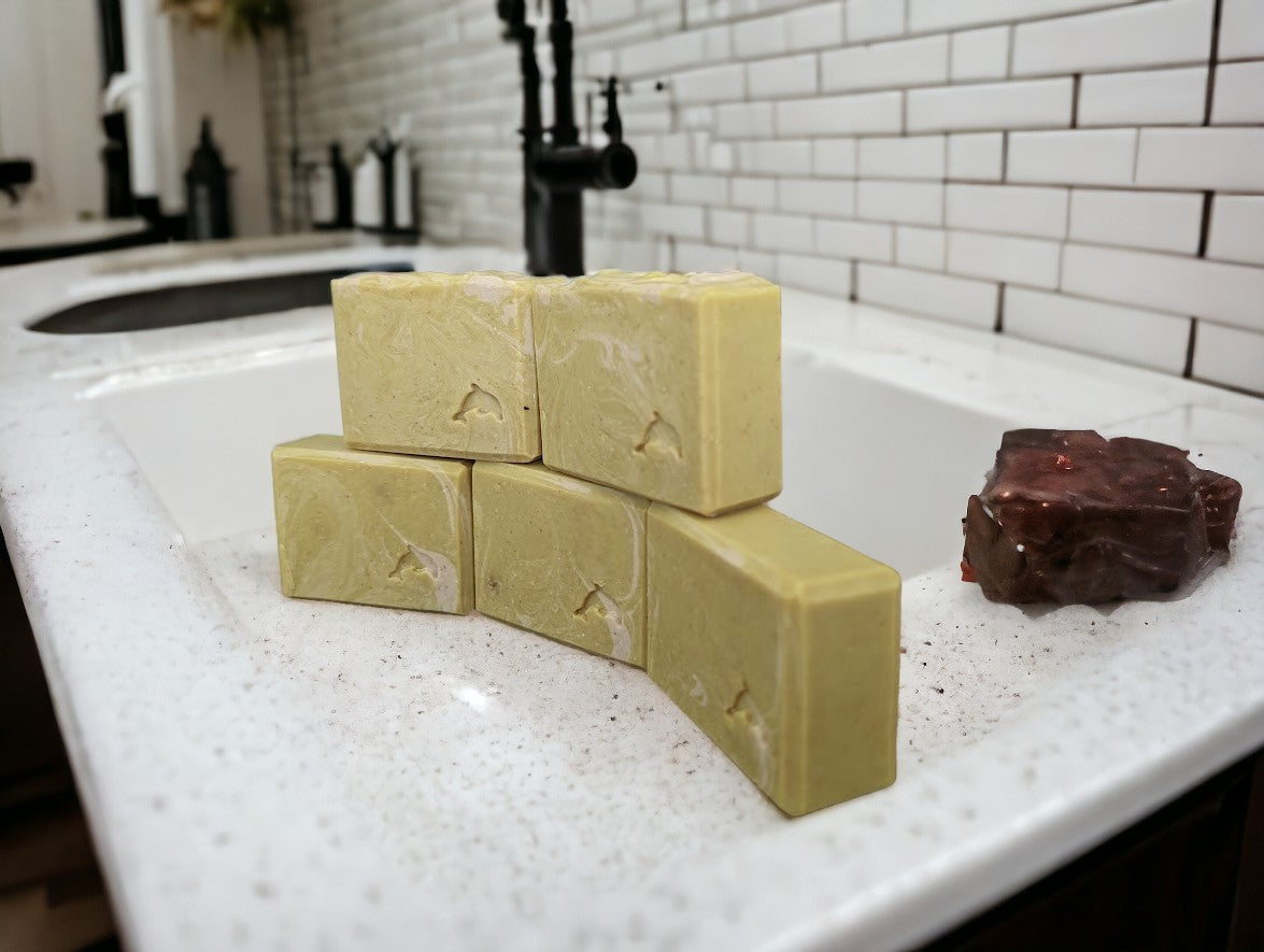 Handcrafted, cold process Banana Breeze Bar soap (aka Monkey Farts) featuring Goat Milk Soap, Colloidal oats and kaolin clay to up your shower game.  Mustard colored base with white swirls. Available in 3 sizes Regular bar, small bar and Travel Guest Hotel sized soap bar. Available from Cheryl's Southern Soapery.