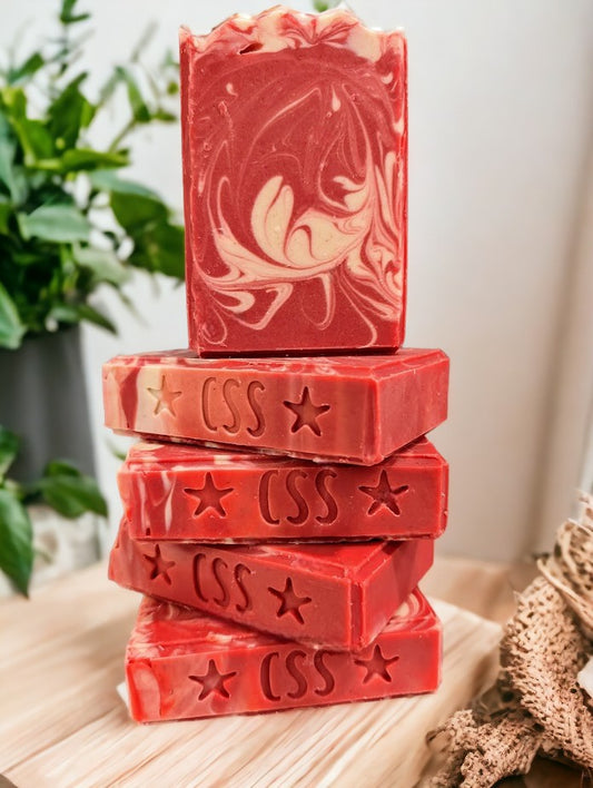 Handcrafted cold processed soap.  Strawberry Red colored soap with white swirls.  Fresh Picked Strawberry fragrance oil.  3 sizes:  Regular, Small and Travel Size.