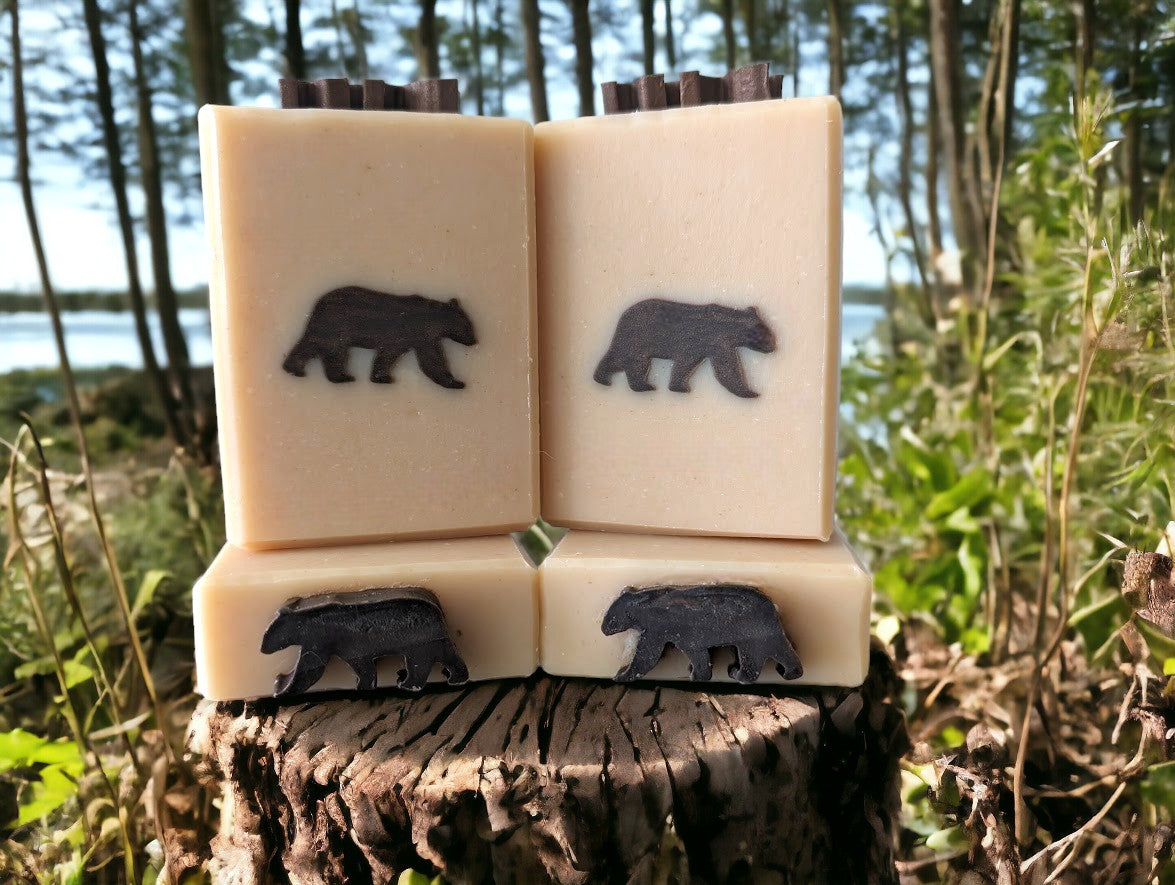 This artisan soap boasts a delightful dark brown bear-shaped embed on a light tan base. Formulated with luxurious goat milk & tallow, this soap is a treasure trove of nourishing ingredients such as Kaolin Clay & Colloidal Oats. Bump up your personal care routine & lather up with this gentle bar and your skin will feel 'bear-y' pampered.