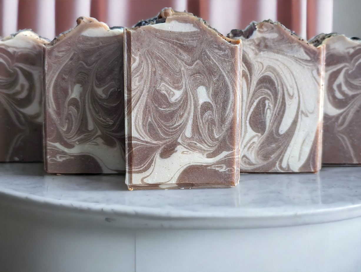 Cold process coffee soap bar.  Darker Brown with creamy colored swirls.  This Project Soapway Competition winner is loaded up with skin loving ingredients like Kaolin Clay & Colloidal oats, this sudsy delight is handcrafted with organic fresh brewed coffee & Espresso coffee fragrance oil. Up your skin care game with this good for your skin soap that delivers a crazy big & delightful lather. 