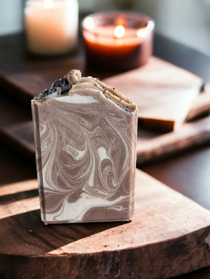 Cold process coffee soap bar with Kaolin Clay and Colloidal Oats.  Darker Brown with creamy colored swirls.  This Project Soapway Competition winner is loaded up with skin loving ingredients and is handcrafted with organic fresh brewed coffee & Espresso coffee fragrance oil. Up your bath product game with this good for your skin soap that delivers a crazy big & delightful lather. 