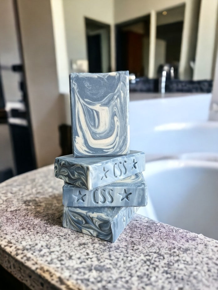 Main soap color is blue with creamy white swirls. Loaded with kaolin clay, colloidal oats and other good for your skin ingredients.  Up your Personal Care game with Blueberry Burst Soap from Cheryl's Southern Soapery.