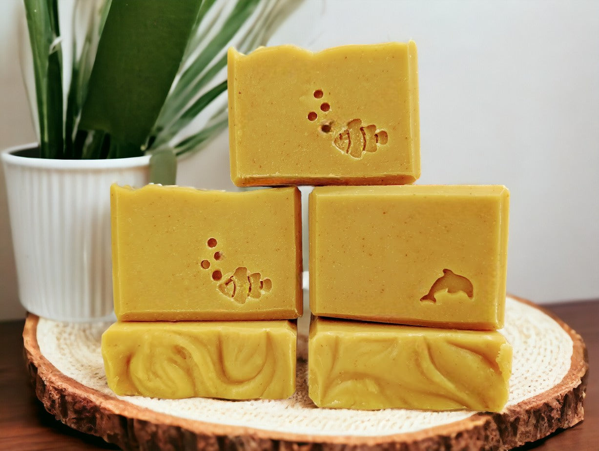 Handcrafted, nourishing, good for your skin soap bar for bath and shower. Medium yellow in color, scented with Lemon.  Available in 3 Sizes.  Small and Travel bars stamped with clown fish, dolphin or sea horse.  Features Avocado Oil, Mango Butter, Colloidal Oats and Kaolin Clay.