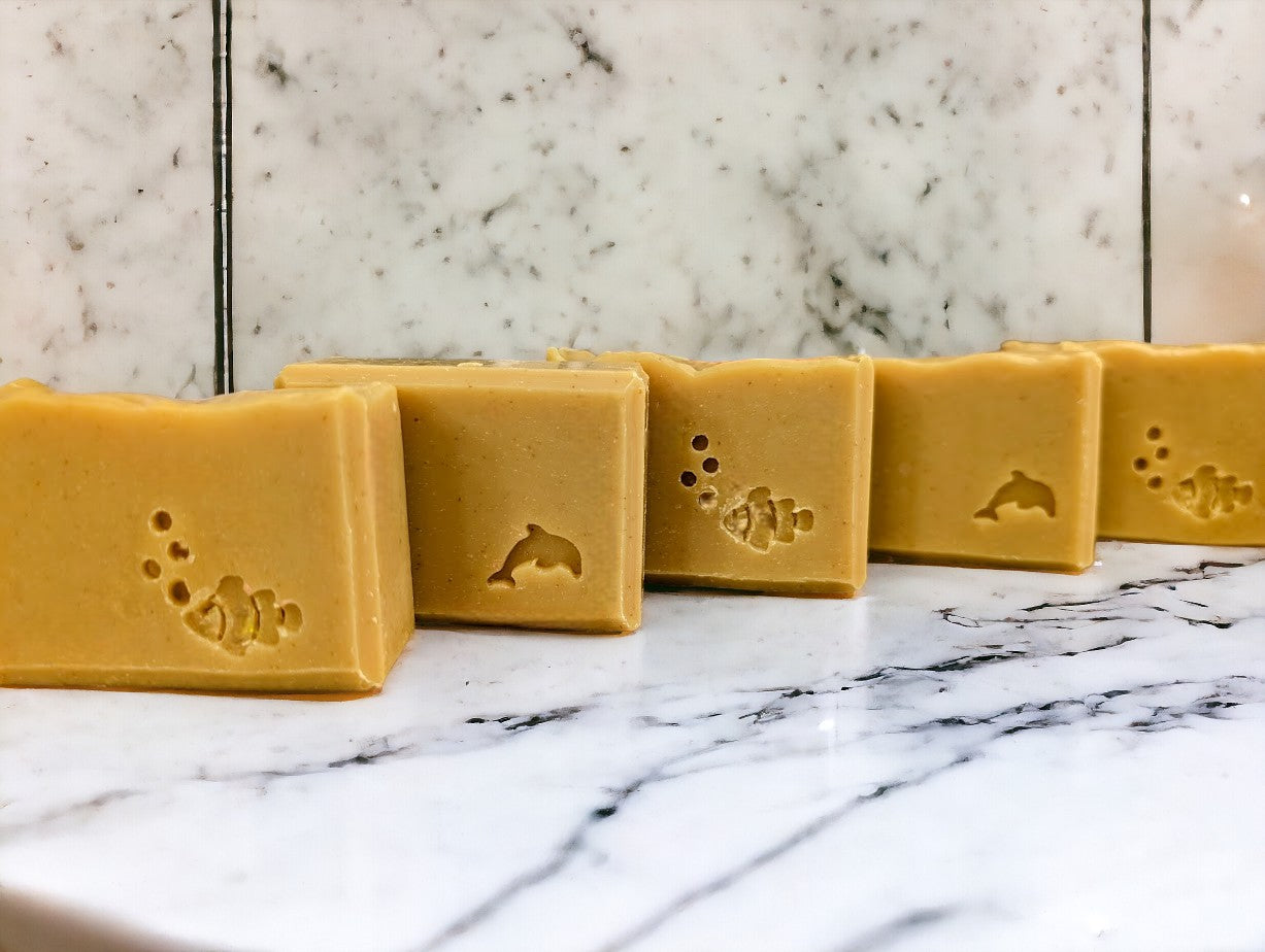 Handcrafted, nourishing, good for your skin soap bar for bath and shower. Medium yellow in color, scented with Lemon.  Available in 3 Sizes.  Small and Travel bars stamped with sea creatures.  Features Avocado Oil, Mango Butter, Colloidal Oats and Kaolin Clay