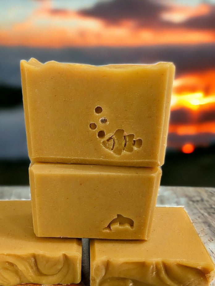 Cold processed soap bar all darker yellow soap scented with Lemon.  Available in 3 Sizes.  Small and Travel bars stamped with sea creatures.  Features Avocado Oil, Mango Butter, Colloidal Oats and Kaolin Clay.  Fresh Lemon fragrance oil. 