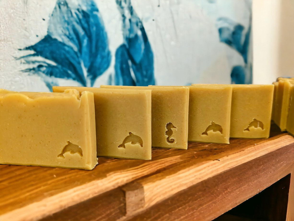 Handcrafted, cold process soap bar. Medium yellow in color, scented with Lemon.  Available in 3 Sizes.  Small and Travel bars stamped with sea creatures.  Features Avocado Oil, Mango Butter, Colloidal Oats and Kaolin Clay.  Nourishing soap for your skin care needs.  