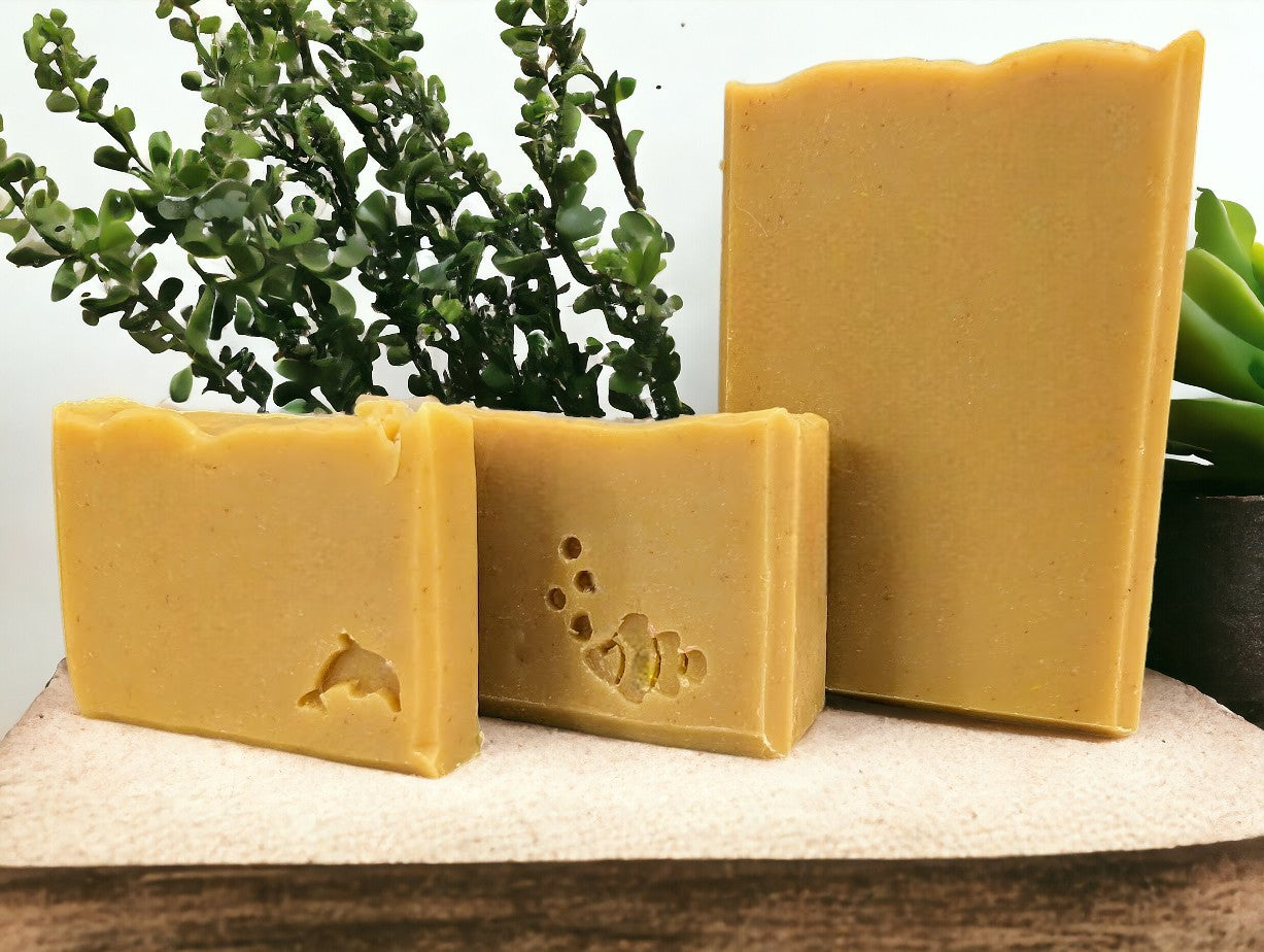 Handcrafted, nourishing, good for your skin soap bar for bath and shower. Medium yellow in color, scented with Lemon.  Available in 3 Sizes.  Small and Travel soap bars stamped with clown fish, dolphin or sea horse.  Features Avocado Oil, Mango Butter, Colloidal Oats and Kaolin Clay.