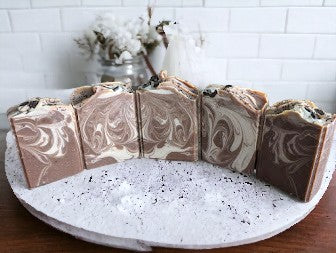 Cold process bar.  Darker Brown coffee soap with creamy colored swirls.  This Project Soapway Competition winner is loaded up with skin loving ingredients like Kaolin Clay & Colloidal oats, this sudsy delight is handcrafted with organic fresh brewed coffee & Espresso coffee fragrance oil. Up your personal care game with this good for your skin soap that delivers a crazy big & delightful lather. 