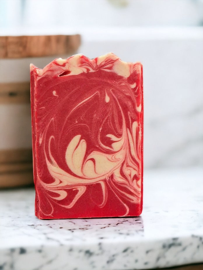 Cold processed soap bar with strawberry red main color with white swirls.  Features Avocado Oil, Colloidal Oats and Kaolin Clay.  Fresh Picked Strawberry fragrance oil.  3 sizes:  Regular, Small and Travel Size for your skin care needs.